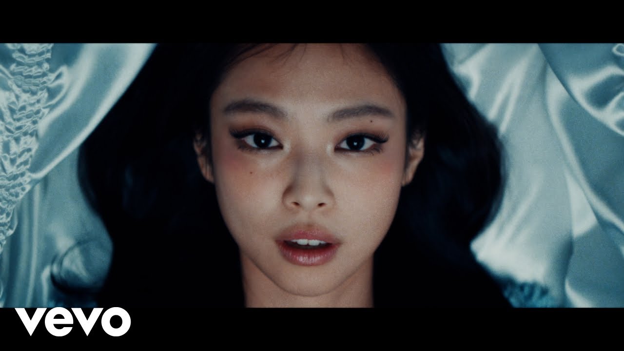 Jennie and Charles Melton in the Love Hangover official music video