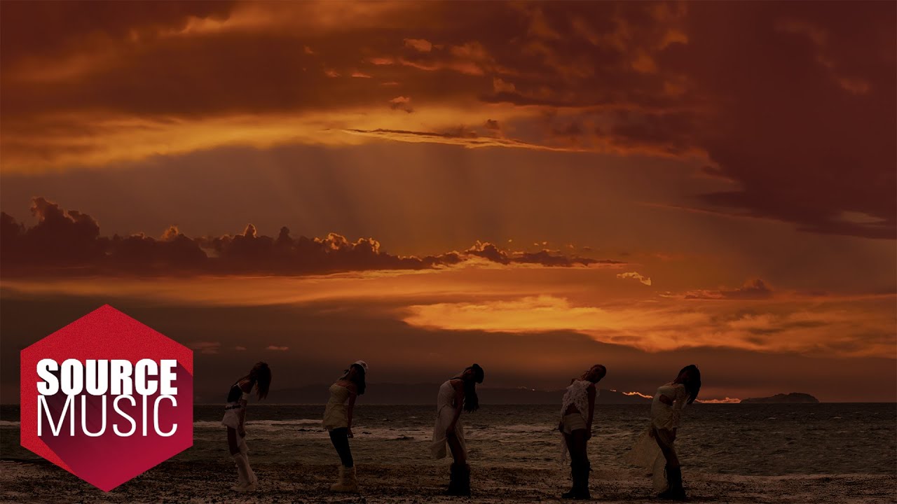 LE SSERAFIM surrounded by fire and impact imagery in the HOT official music video