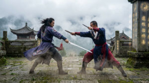 Two martial artists in traditional Chinese clothing fighting with swords in an ancient mountain temple setting, surrounded by mist and stone architecture.
