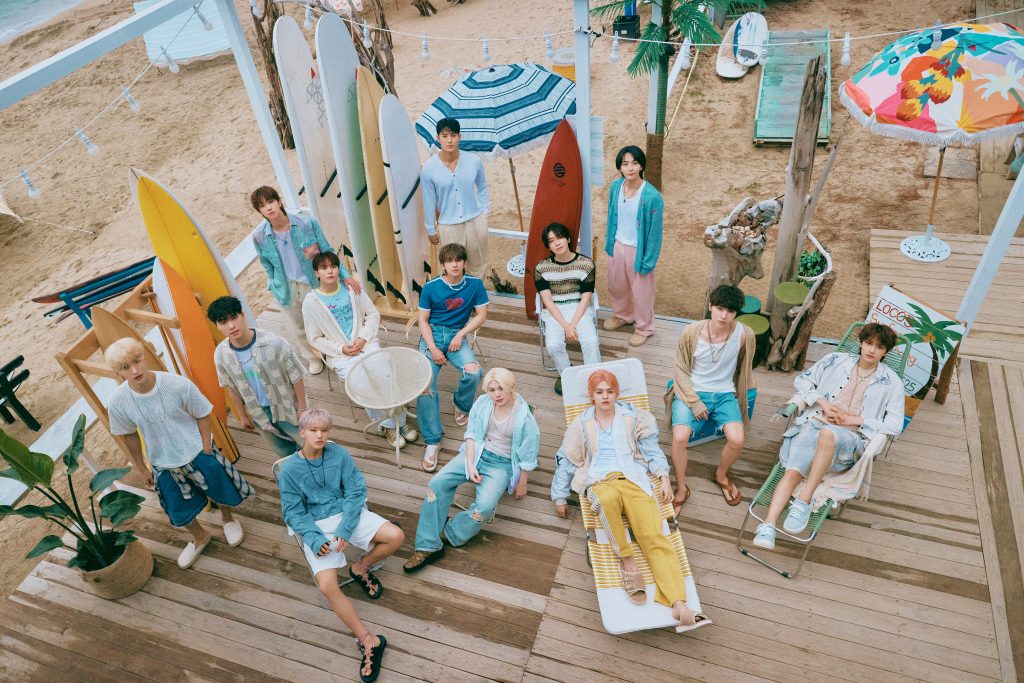 All thirteen members of SEVENTEEN together in an official group photograph