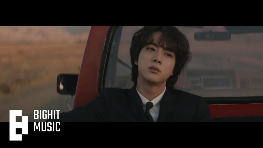 Jin in The Astronaut official music video for his BTS solo React