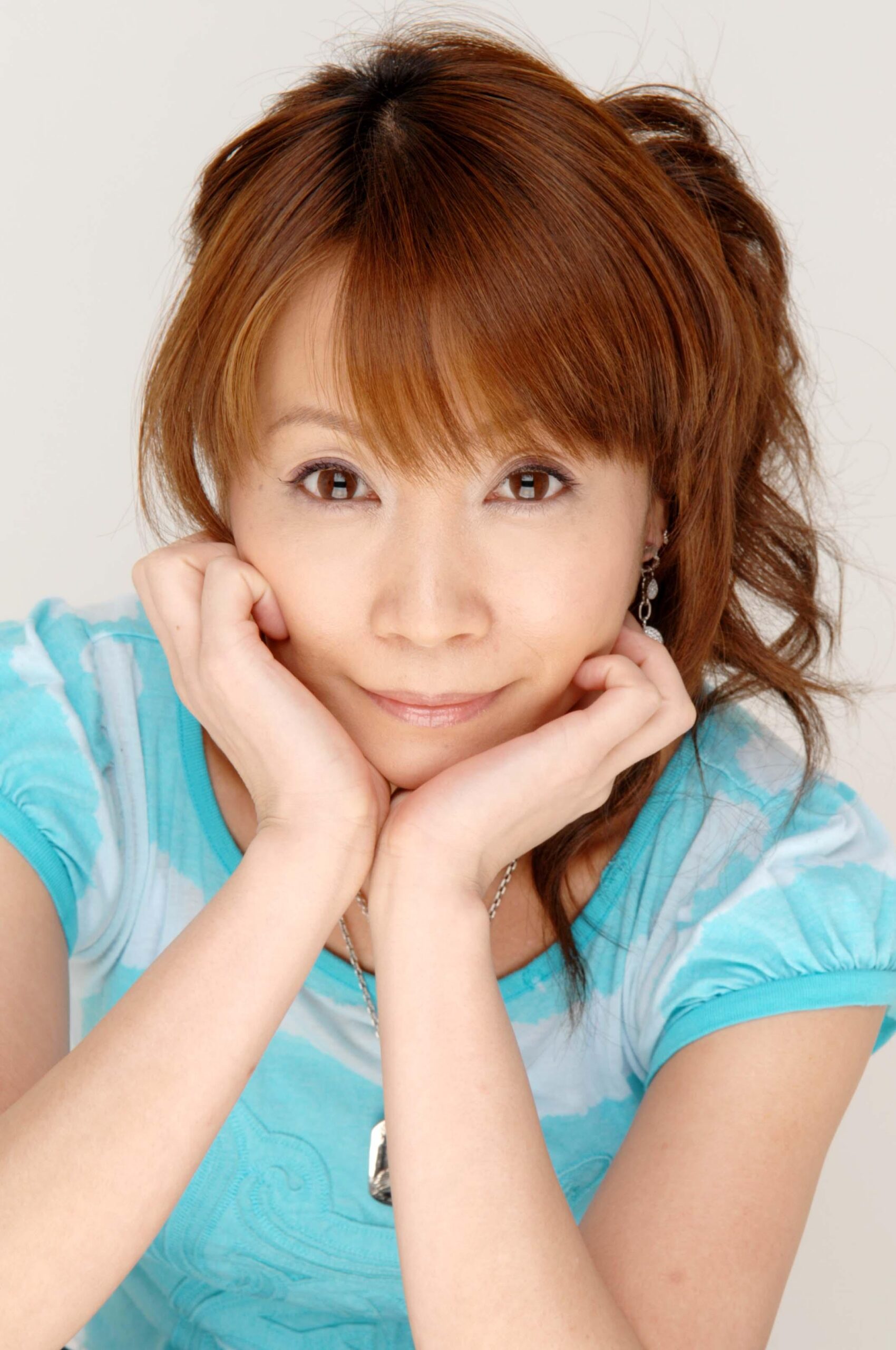 Promotional portrait of Japanese voice actor Junko Takeuchi