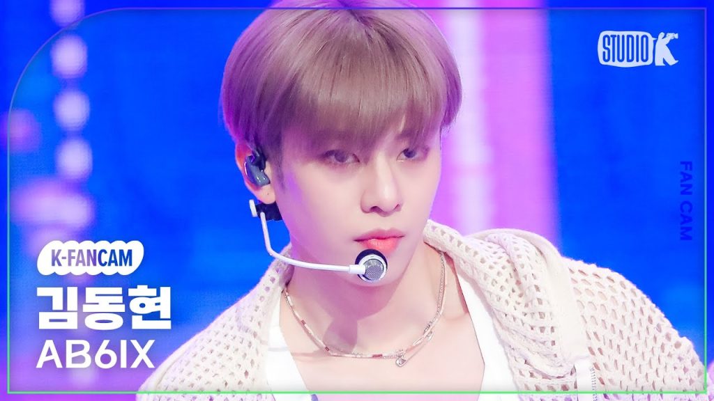 Kim Donghyun in a real official or broadcast performance frame.