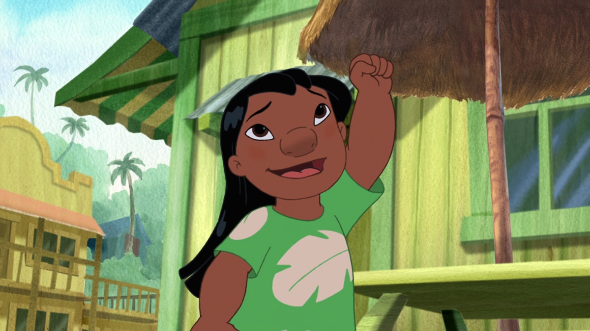 Official episode still of Lilo raising her fist outside a tropical storefront during the Amnesio episode