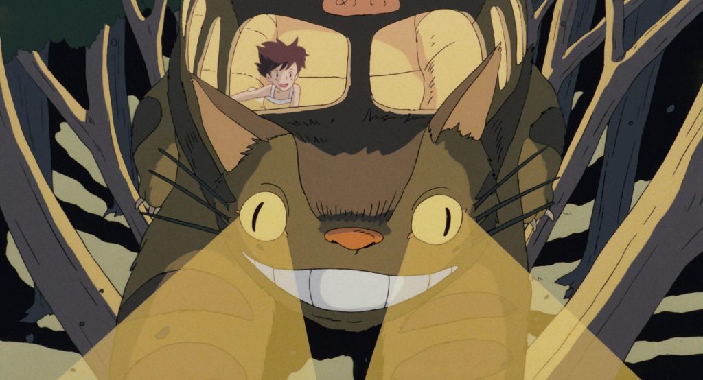 Catbus racing through the trees at night with Satsuki aboard
