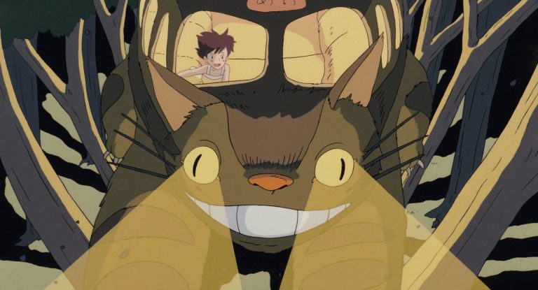 Catbus racing through the trees at night with Satsuki aboard