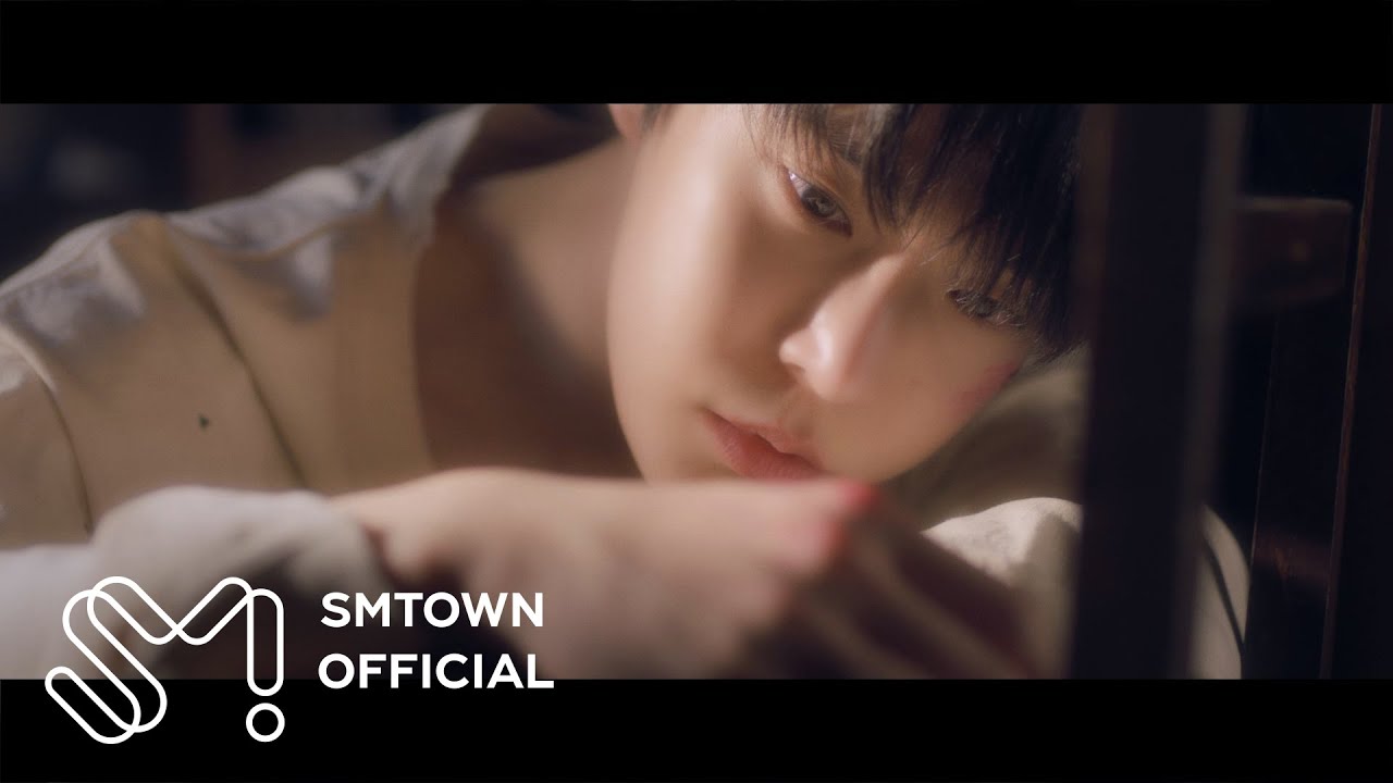 Doyoung in the official Little Light solo music video