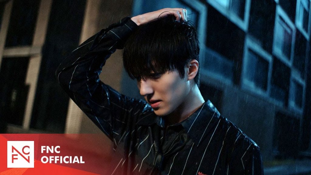 Chani standing in the rain in SF9’s BIBORA music video.