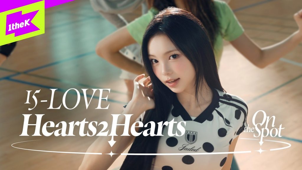 Hearts2Hearts performing 15-LOVE in the exact On the Spot gym-court video