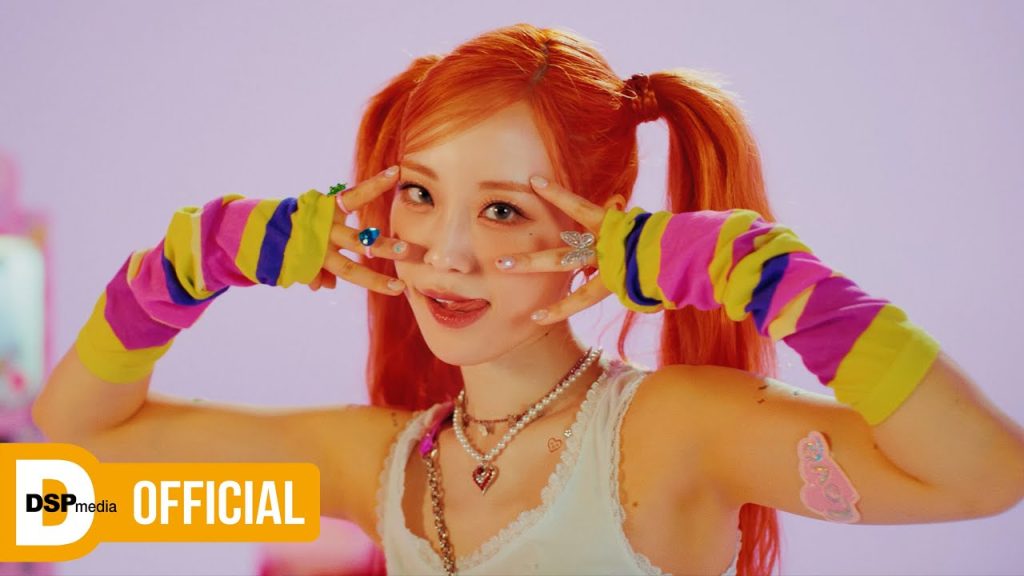 Heo Youngji smiling in the colorful L.O.V.E official solo music video