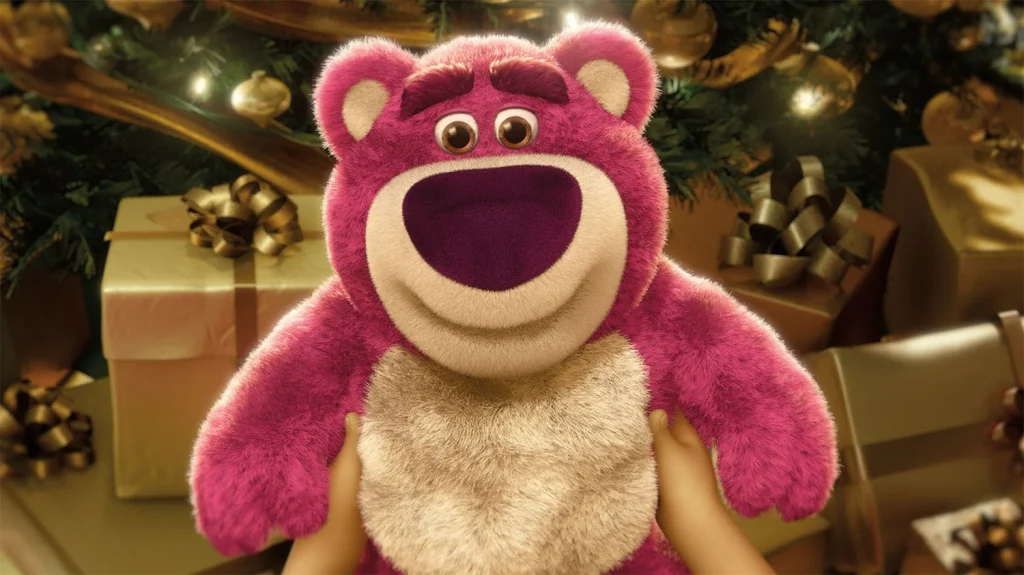 Lots-o-Huggin Bear held in front of wrapped gifts in an official Toy Story 3 image