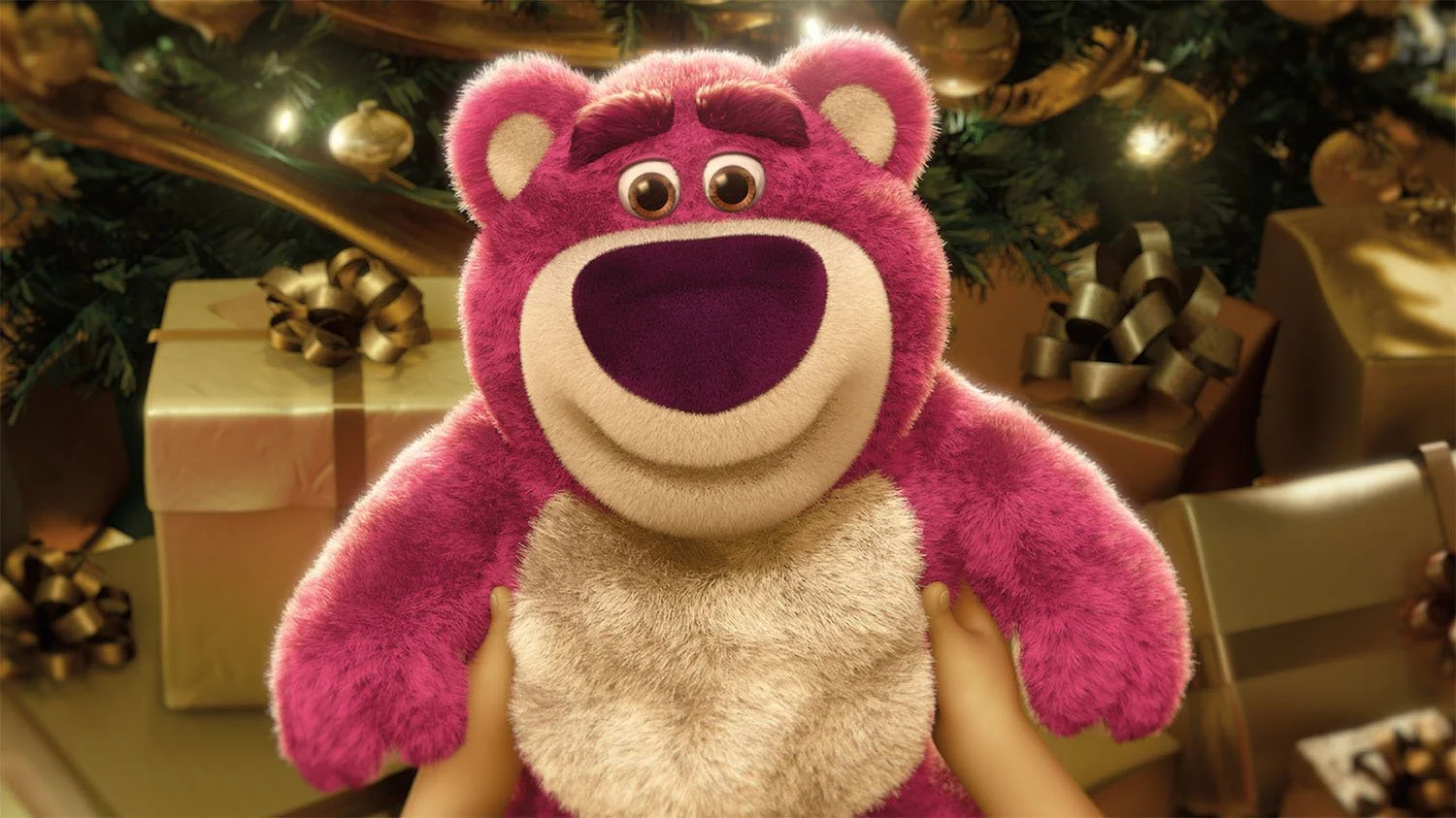 Lots-o-Huggin Bear held in front of wrapped gifts in an official Toy Story 3 image