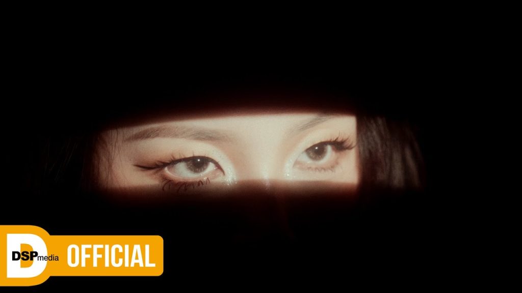 Jiwoo of KARD inside the uncanny domestic sets of the Home Sweet Home music video