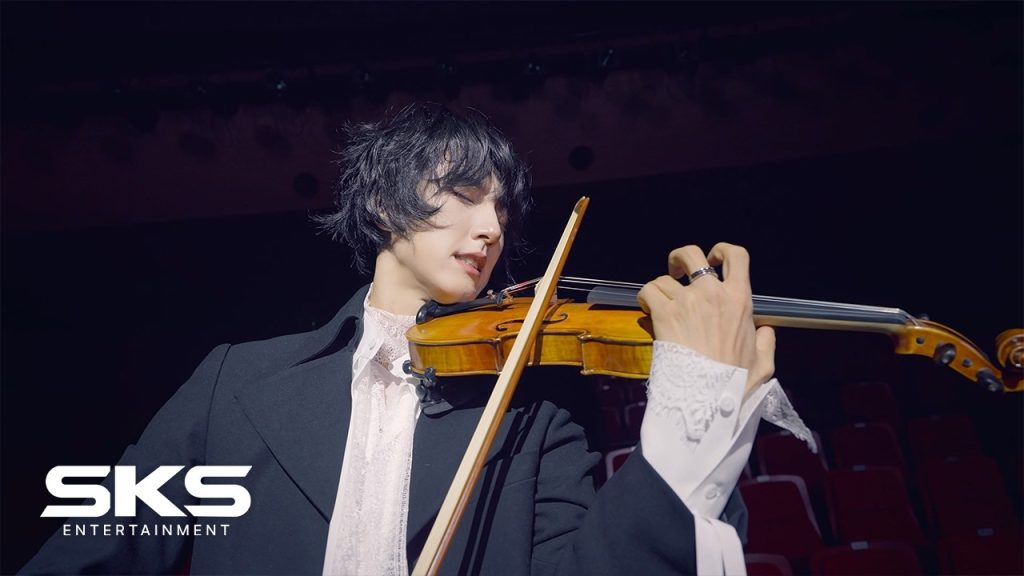 ALL’N performing with violin in the We Up official music video