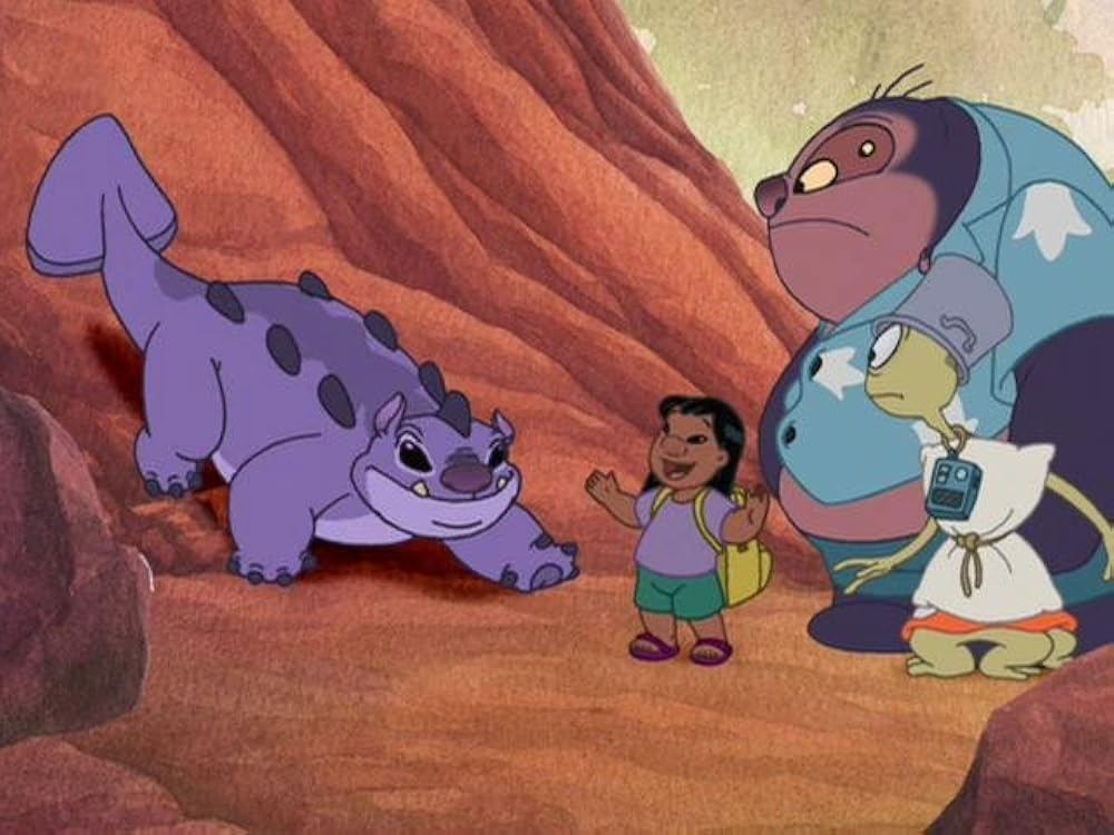 Official episode still of Lilo speaking with Richter while Jumba and Pleakley watch inside a rocky canyon
