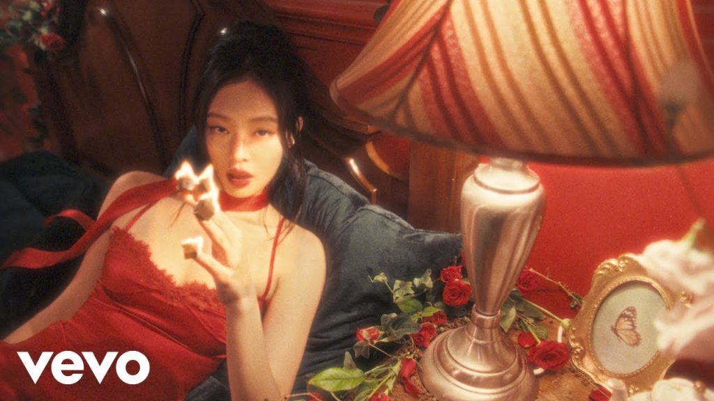 JENNIE in red inside the dark fairy-tale world of the FALLEN ANGEL official video