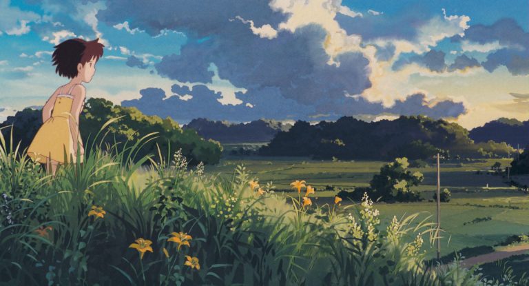 Satsuki looking across rural fields beneath summer storm clouds