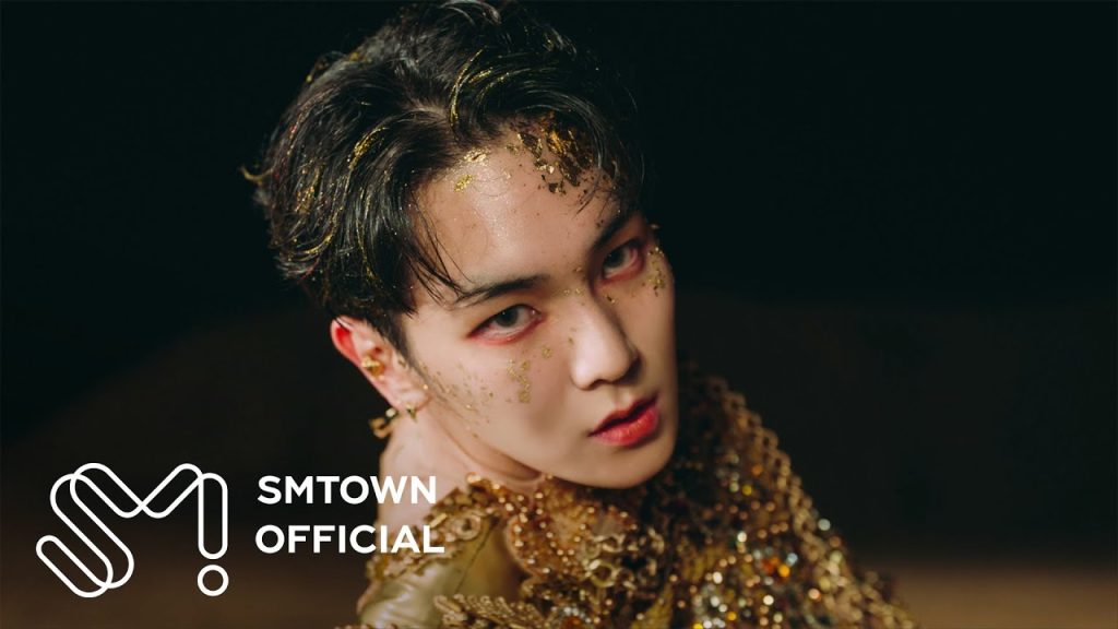 Key in a real official solo music-video frame.