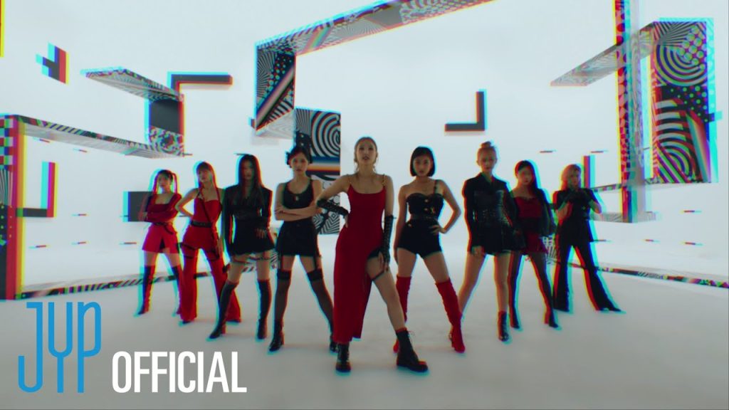 TWICE surrounded by retro computer interfaces in the Talk that Talk official music video