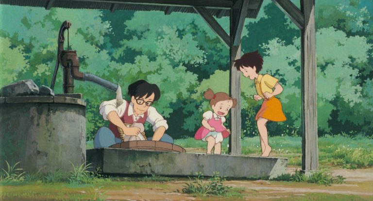 The Kusakabe family working together beside the outdoor well