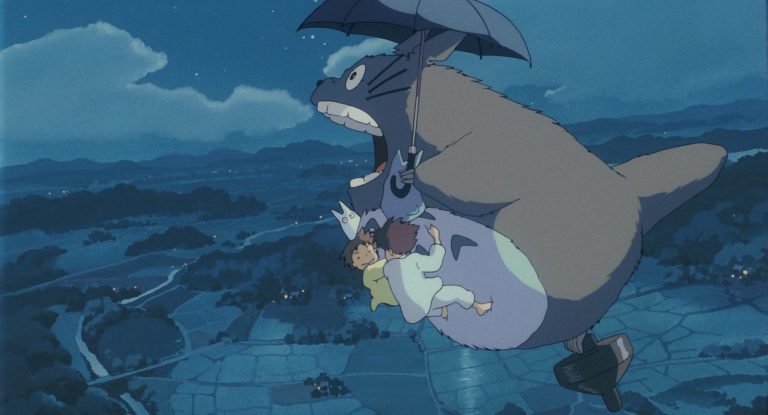 Totoro and the girls flying above fields at night