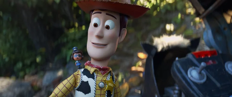 Woody standing beside Duke Caboom with Giggle McDimples on his shoulder in Toy Story 4
