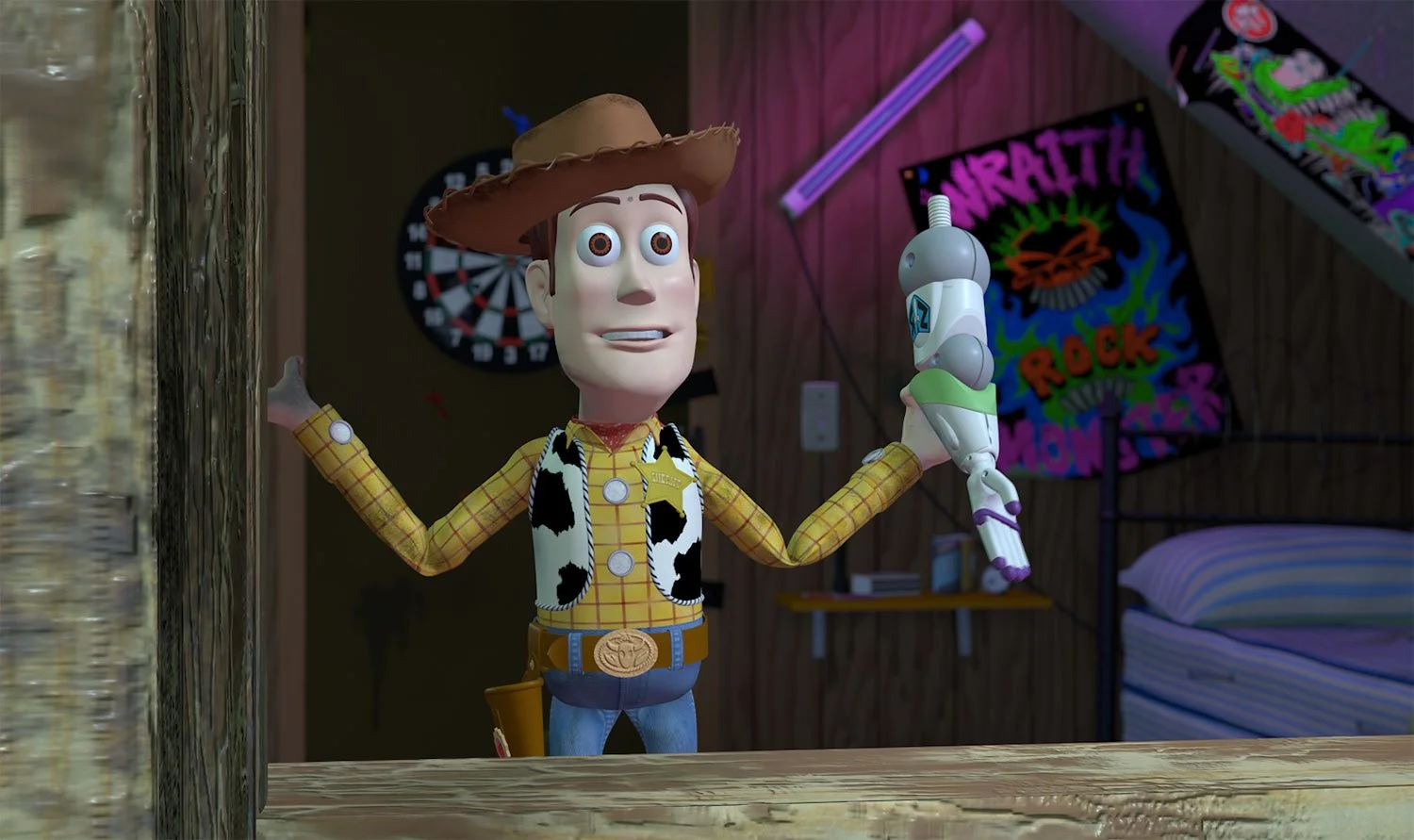Woody holding Buzz Lightyear’s detached arm in Sid’s room