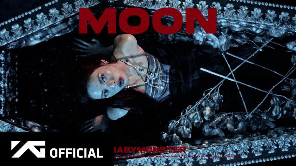 BABYMONSTER in red, black and white supernatural styling beneath the full moon in the MOON official music video