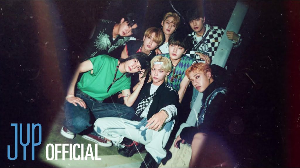 Stray Kids grinning in the official CHEESE video