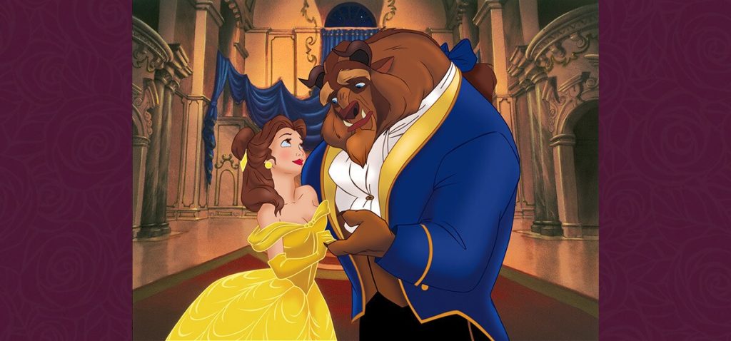 Belle and Beast dancing together in the golden castle ballroom