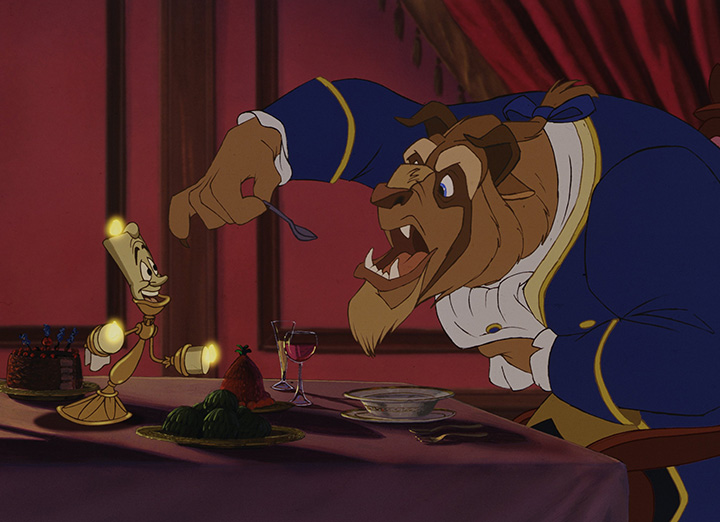 The Beast eating dinner while Lumiere encourages him