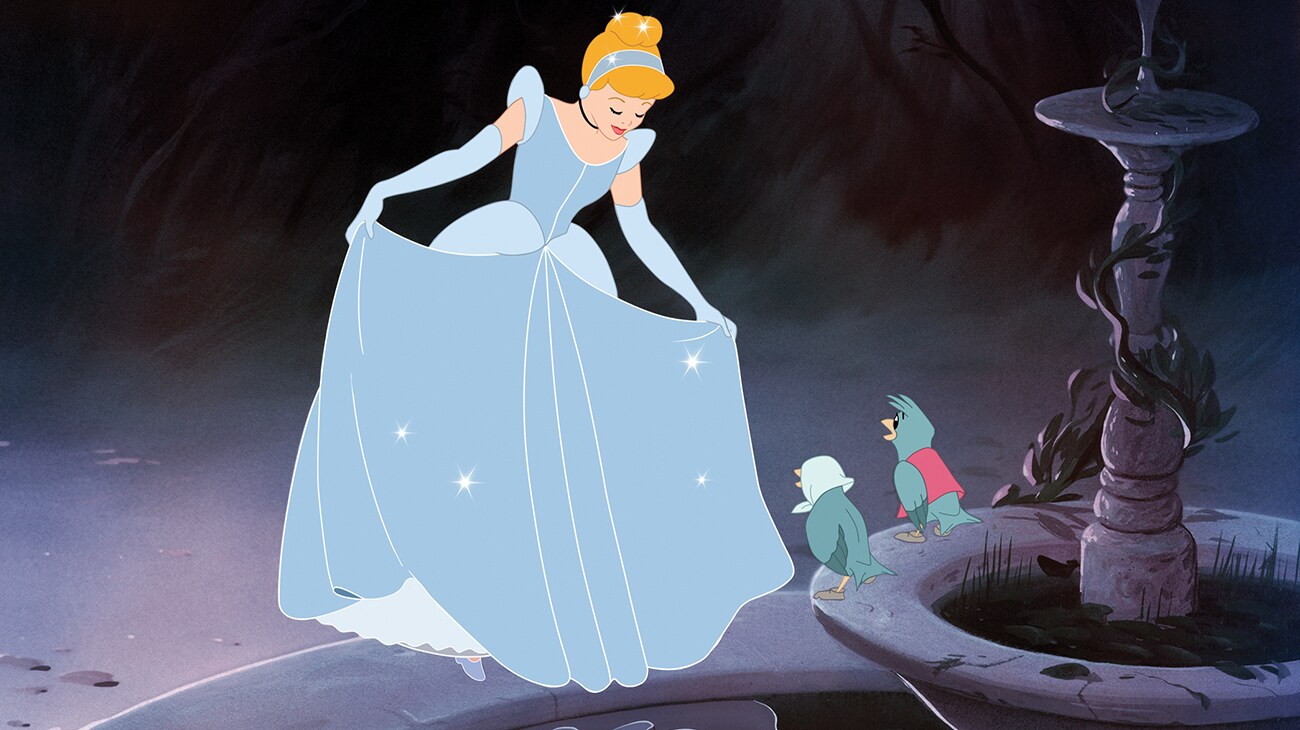 Cinderella shows the handmade dress before the stepsisters destroy it