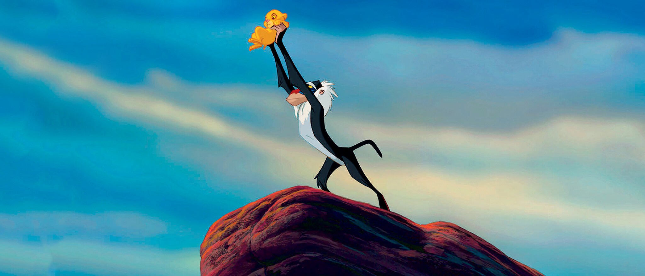 Rafiki presenting baby Simba over Pride Rock in official Disney artwork