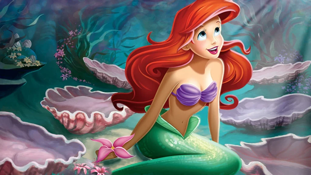 Ariel smiling among coral and shells in an official Disney character image